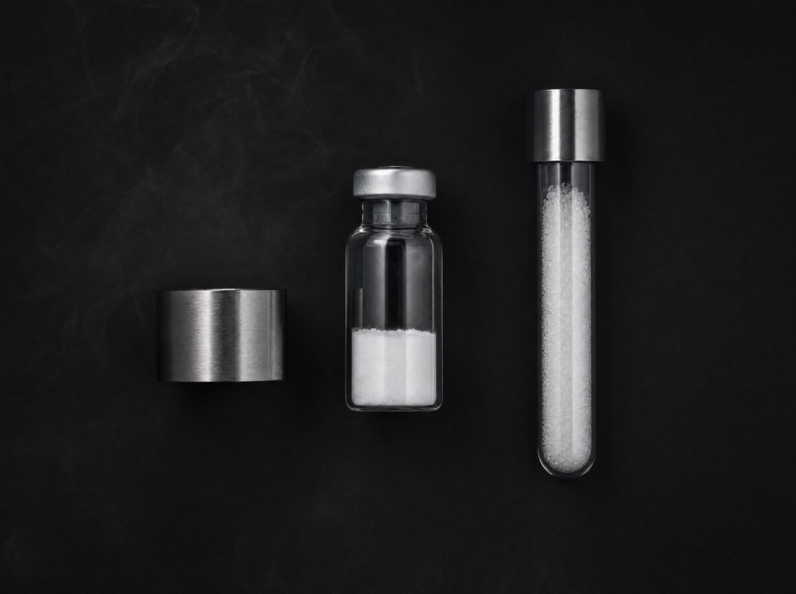 THE ALT/LAB apothecary bench — vial, powder, and crystalline compound